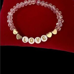 BEADED love bracelet using pink cord ….can be customized ..approx 7”